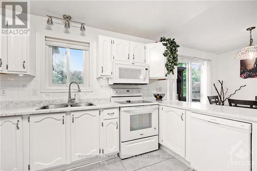 13065 Riverside Drive, South Dundas, ON - Indoor Photo Showing Kitchen With Double Sink