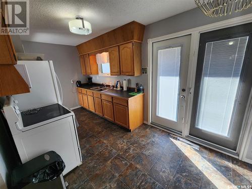 57 11Th Street Ne, Weyburn, SK - Indoor Photo Showing Kitchen With Double Sink