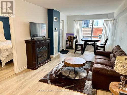 436 - 250 Wellington Street W, Toronto, ON - Indoor Photo Showing Living Room With Fireplace