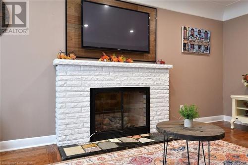 141 S Reid Avenue S, Hamilton, ON - Indoor Photo Showing Living Room With Fireplace