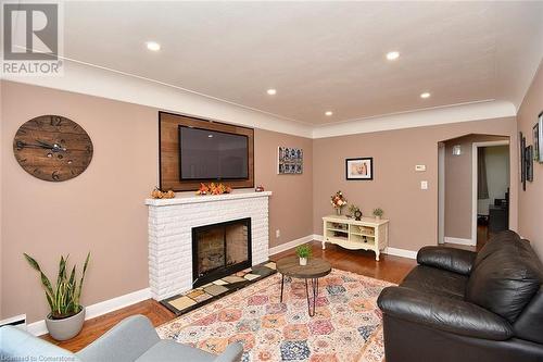 141 S Reid Avenue S, Hamilton, ON - Indoor Photo Showing Living Room With Fireplace