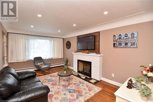 141 S Reid Avenue S, Hamilton, ON - Indoor Photo Showing Living Room With Fireplace