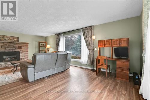 109 Lochiel Street S, Renfrew, ON - Indoor Photo Showing Living Room With Fireplace