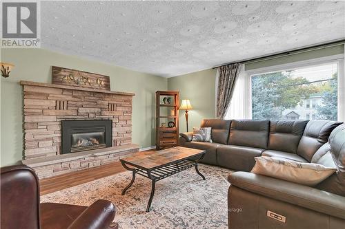 109 Lochiel Street S, Renfrew, ON - Indoor Photo Showing Living Room With Fireplace