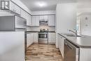 101 - 128 Barrie Street, Bradford West Gwillimbury, ON  - Indoor Photo Showing Kitchen With Double Sink 