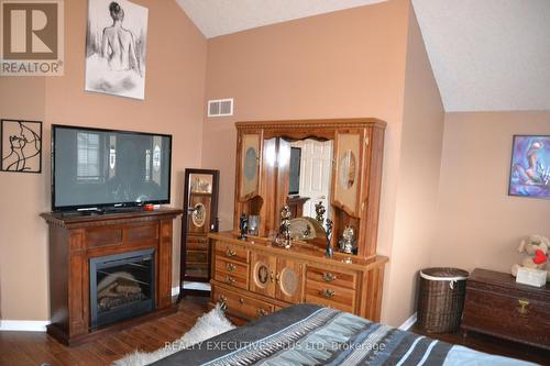 113 Green Gate Boulevard S, Cambridge, ON - Indoor Photo Showing Bedroom With Fireplace