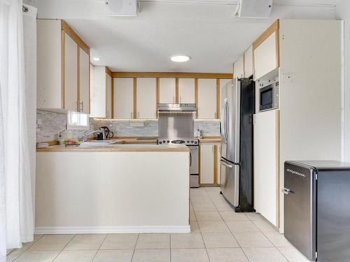 Kitchen - 1025 Rue Mirelle, Laval (Saint-François), QC - Indoor Photo Showing Kitchen