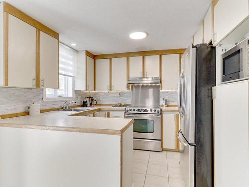 Kitchen - 1025 Rue Mirelle, Laval (Saint-François), QC - Indoor Photo Showing Kitchen