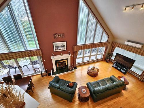 Salon - 633 Rue Lalande, Saint-André-D'Argenteuil, QC - Indoor Photo Showing Living Room With Fireplace