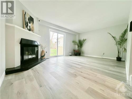 Family Room | Fireplace - 12 Millrise Lane Unit#F, Nepean, ON - Indoor With Fireplace