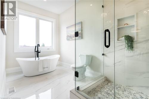 Freestanding tub for end of the day relaxation - 1 West Avenue, Stoney Creek, ON - Indoor Photo Showing Bathroom