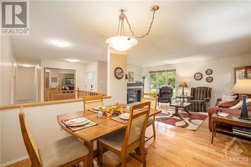 Open concept Dining & Living Room - 10 Chimo Drive, Kanata, ON - Indoor Photo Showing Dining Room With Fireplace