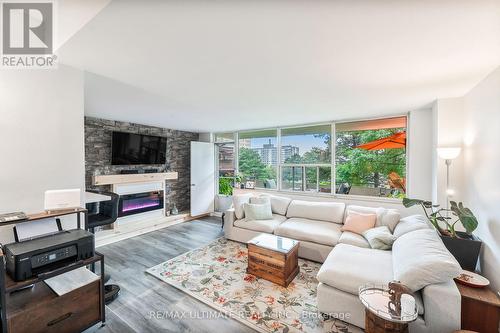 204 - 20 Forest Manor Road, Toronto, ON - Indoor Photo Showing Living Room With Fireplace