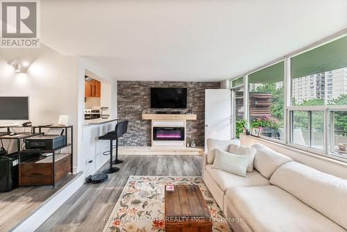 204 - 20 Forest Manor Road, Toronto, ON - Indoor Photo Showing Living Room With Fireplace