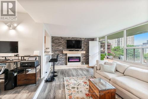 204 - 20 Forest Manor Road, Toronto, ON - Indoor Photo Showing Living Room With Fireplace