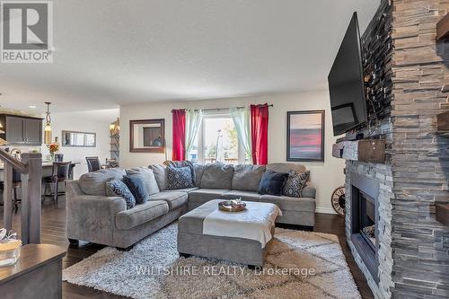 335 Talbot Street, Norfolk (Courtland), ON - Indoor Photo Showing Living Room With Fireplace