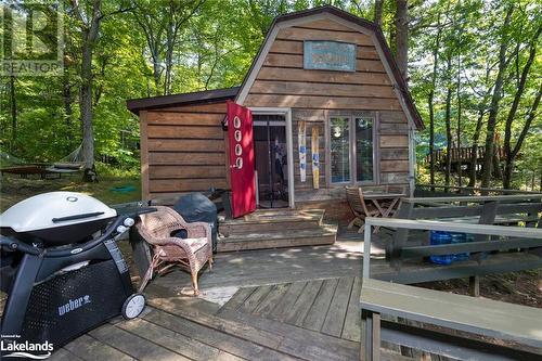 Bunkie is just off The Deck and Entrance to The Cottage - 21 Severn River Sr406 Shores S, Muskoka Lakes Twp, ON - Outdoor With Deck Patio Veranda