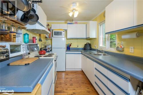 Galley Kitchen - 21 Severn River Sr406 Shores S, Muskoka Lakes Twp, ON - Indoor Photo Showing Kitchen With Double Sink