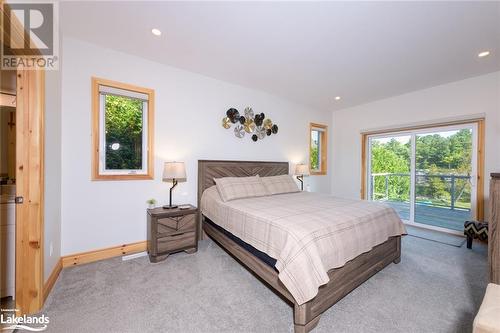 Primary Bedroom with Walk out to Deck - 149 John Buchler Road, Port Severn, ON - Indoor Photo Showing Bedroom