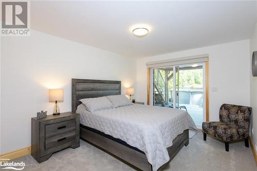 2nd Bedroom in Lower Level with Walk Out to covered Deck - 149 John Buchler Road, Port Severn, ON - Indoor Photo Showing Bedroom