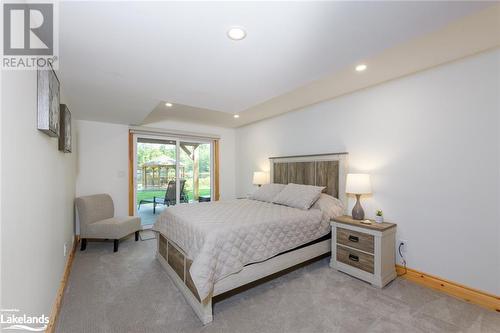 3rd Bedroom in Lower Level with Walk Out to covered Deck - 149 John Buchler Road, Port Severn, ON - Indoor Photo Showing Bedroom