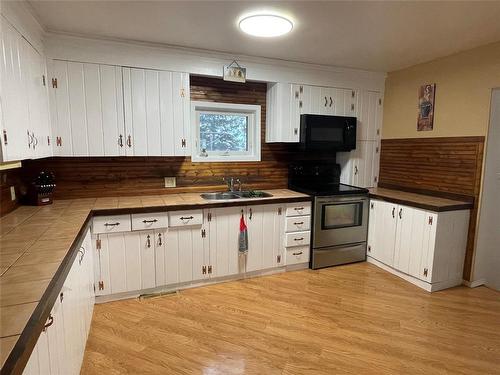 121133 87W Road, Mccreary, MB - Indoor Photo Showing Kitchen With Double Sink