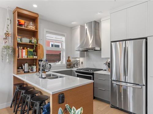 101-1765 Oak Bay Ave, Victoria, BC - Indoor Photo Showing Kitchen With Stainless Steel Kitchen With Double Sink With Upgraded Kitchen