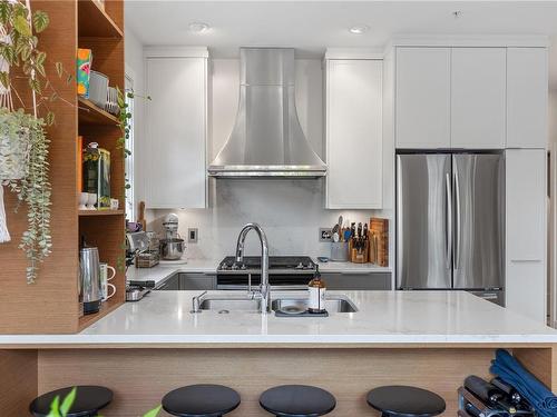 101-1765 Oak Bay Ave, Victoria, BC - Indoor Photo Showing Kitchen With Stainless Steel Kitchen With Double Sink With Upgraded Kitchen