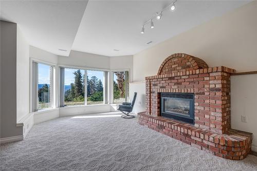 3018 Debeck Road, Naramata, BC - Indoor Photo Showing Living Room With Fireplace