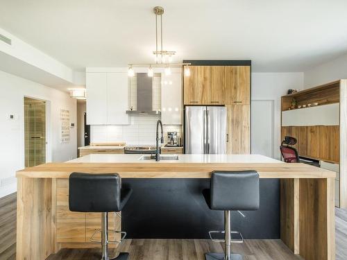 Kitchen - 7-303 Rue De L'Aigle, Carignan, QC - Indoor Photo Showing Kitchen With Upgraded Kitchen