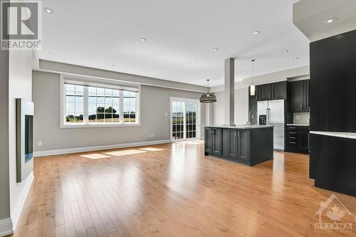 Living Room With Gas Fireplace - 1326 Kingston Avenue, Ottawa, ON - Indoor Photo Showing Kitchen With Upgraded Kitchen