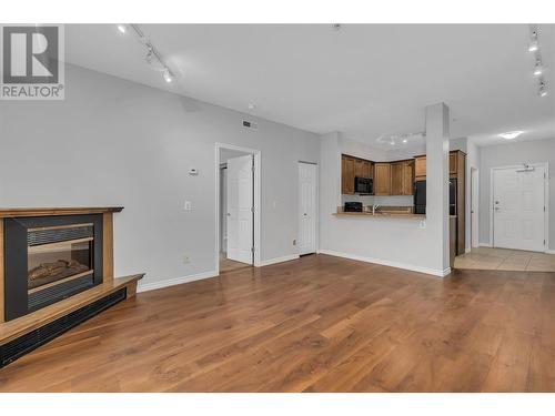 1007 Harvey Avenue Unit# 204, Kelowna, BC - Indoor Photo Showing Living Room With Fireplace