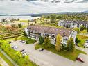 Photo aÃ©rienne - 305-2100 Place Du Club-Memphré, Magog, QC  - Outdoor With Body Of Water With View 