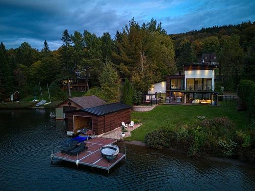 Face arriÃ¨re - 245 Ch. Du Tour-Du-Lac, Lac-Beauport, QC - Outdoor With Body Of Water With Deck Patio Veranda