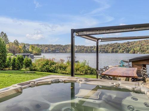 Spa - 245 Ch. Du Tour-Du-Lac, Lac-Beauport, QC - Outdoor With Body Of Water With View