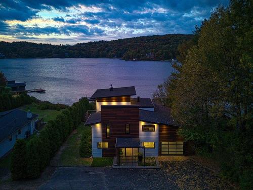 FaÃ§ade - 245 Ch. Du Tour-Du-Lac, Lac-Beauport, QC - Outdoor With Body Of Water With View