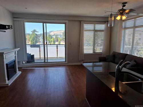 304-866 Goldstream Ave, Langford, BC - Indoor Photo Showing Kitchen With Fireplace