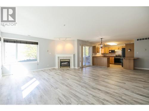 6805 Cottonwood Drive Unit# 100, Osoyoos, BC - Indoor Photo Showing Living Room With Fireplace