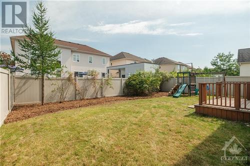 Wide backyard with play structure - 107 Mangrove Crescent, Ottawa, ON - Outdoor