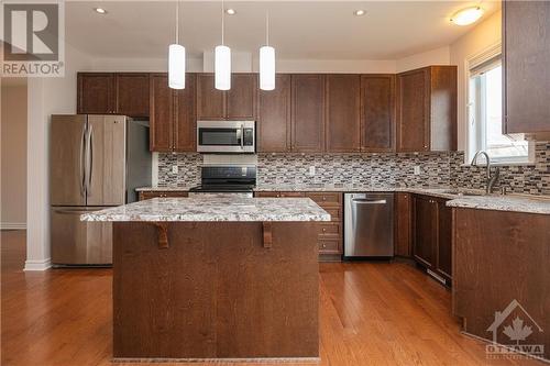 Granite countertops in the Kitchen with island & pot drawers - 107 Mangrove Crescent, Ottawa, ON - Indoor Photo Showing Kitchen With Upgraded Kitchen