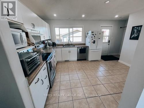 9614 77 Avenue, Grande Prairie, AB - Indoor Photo Showing Kitchen With Double Sink