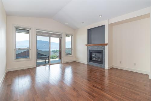 2168 Alvarado Trail, Westbank, BC - Indoor Photo Showing Living Room With Fireplace