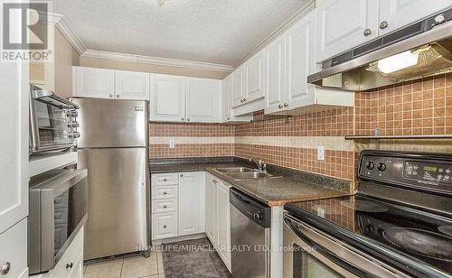 402 - 2900 Battleford Road, Mississauga, ON - Indoor Photo Showing Kitchen With Double Sink