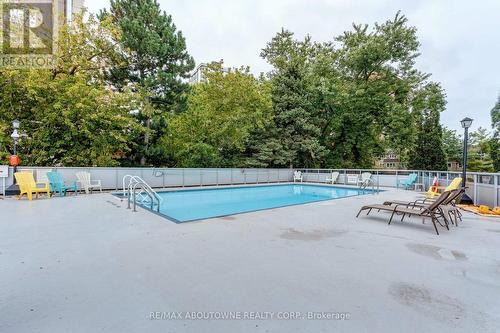 1006 - 2263 Marine Drive, Oakville, ON - Outdoor With In Ground Pool With Backyard