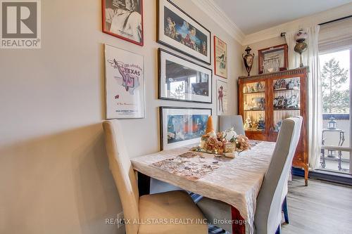 213 - 11121 Yonge Street, Richmond Hill, ON - Indoor Photo Showing Dining Room With Fireplace