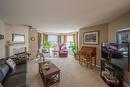 305-1445 Halifax Street, Penticton, BC  - Indoor Photo Showing Living Room With Fireplace 