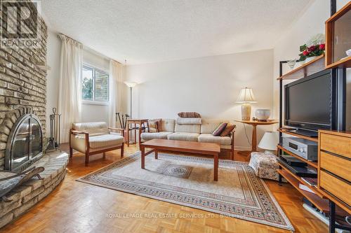 16 Rooksnest Trail, Toronto, ON - Indoor Photo Showing Living Room With Fireplace