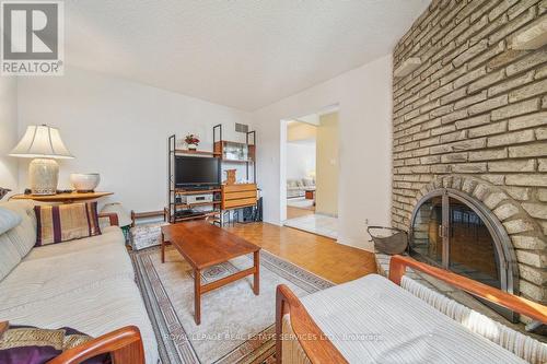 16 Rooksnest Trail, Toronto, ON - Indoor Photo Showing Living Room With Fireplace