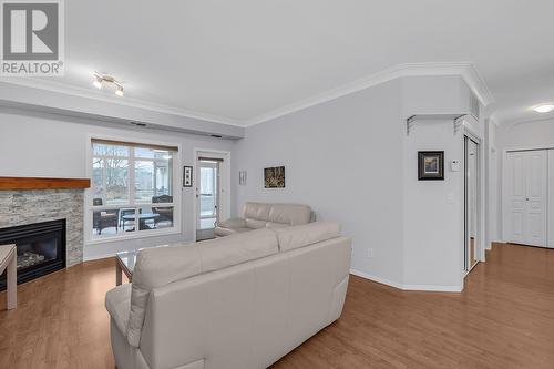 2300 Benvoulin Road Unit# 212, Kelowna, BC - Indoor Photo Showing Living Room With Fireplace