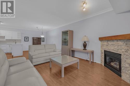 2300 Benvoulin Road Unit# 212, Kelowna, BC - Indoor Photo Showing Living Room With Fireplace